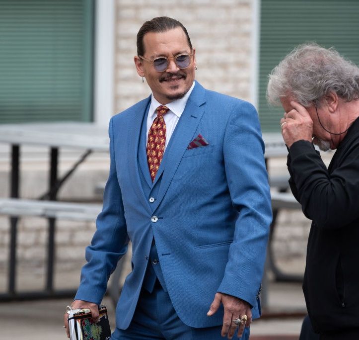 FAIRFAX, VA - May 24: (NY & NJ NEWSPAPERS OUT) Johnny Depp walks with Beechy Colclough during a recess in the days testimony outside court during the Johnny Depp and Amber Heard civil trial at Fairfax County Circuit Court on May 25, 2022 in Fairfax, Virginia. Depp is seeking $50 million in alleged damages to his career over an op-ed Heard wrote in the Washington Post in 2018.(Photo by Cliff Owen/Consolidated News Pictures/Getty Images)