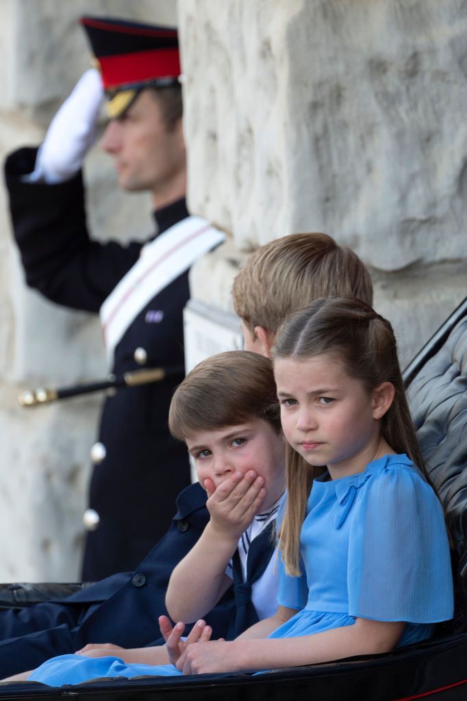 LONDON, ENGLAND - JUNE 02:  Princess Charlotte of Cambridge, Prince George of Cambridge and Prince Louis of Cambridge ride in a carriage during Trooping The Colour at Horeguards parade, on June 2, 2022 in London, England. Trooping The Colour, also known as The Queen's Birthday Parade, is a military ceremony performed by regiments of the British Army that has taken place since the mid-17th century. It marks the official birthday of the British Sovereign. This year, from June 2 to June 5, 2022, there is the a