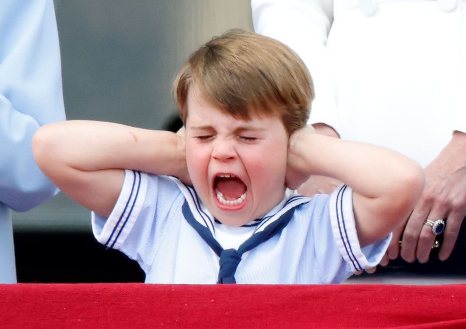 LONDON, UNITED KINGDOM - JUNE 02: (EMBARGOED FOR PUBLICATION IN UK NEWSPAPERS UNTIL 24 HOURS AFTER CREATE DATE AND TIME) Prince Louis of Cambridge covers his ears whilst watching a flypast from the balcony of Buckingham Palace during Trooping the Colour on June 2, 2022 in London, England. Trooping The Colour, also known as The Queen's Birthday Parade, is a military ceremony performed by regiments of the British Army that has taken place since the mid-17th century. It marks the official birthday of the Briti