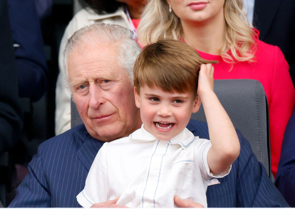LONDON, UNITED KINGDOM - JUNE 05: (EMBARGOED FOR PUBLICATION IN UK NEWSPAPERS UNTIL 24 HOURS AFTER CREATE DATE AND TIME) Prince Louis of Cambridge sits on his grandfather Prince Charles, Prince of Wales's lap as they attend the Platinum Pageant on The Mall on June 5, 2022 in London, England. The Platinum Jubilee of Elizabeth II is being celebrated from June 2 to June 5, 2022, in the UK and Commonwealth to mark the 70th anniversary of the accession of Queen Elizabeth II on 6 February 1952. (Photo by Max Mumb