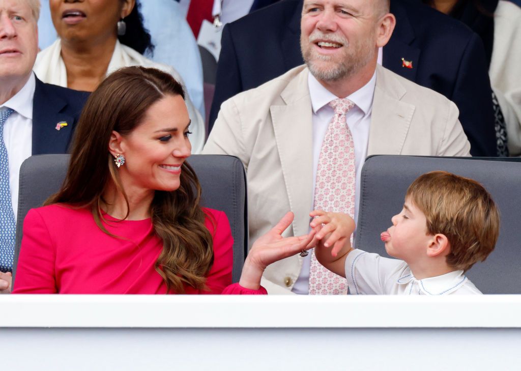 LONDON, UNITED KINGDOM - JUNE 05: (EMBARGOED FOR PUBLICATION IN UK NEWSPAPERS UNTIL 24 HOURS AFTER CREATE DATE AND TIME) Prince Louis of Cambridge sticks his tongue out at his mother Catherine, Duchess of Cambridge as they attend the Platinum Pageant on The Mall on June 5, 2022 in London, England. The Platinum Jubilee of Elizabeth II is being celebrated from June 2 to June 5, 2022, in the UK and Commonwealth to mark the 70th anniversary of the accession of Queen Elizabeth II on 6 February 1952. (Photo by Ma