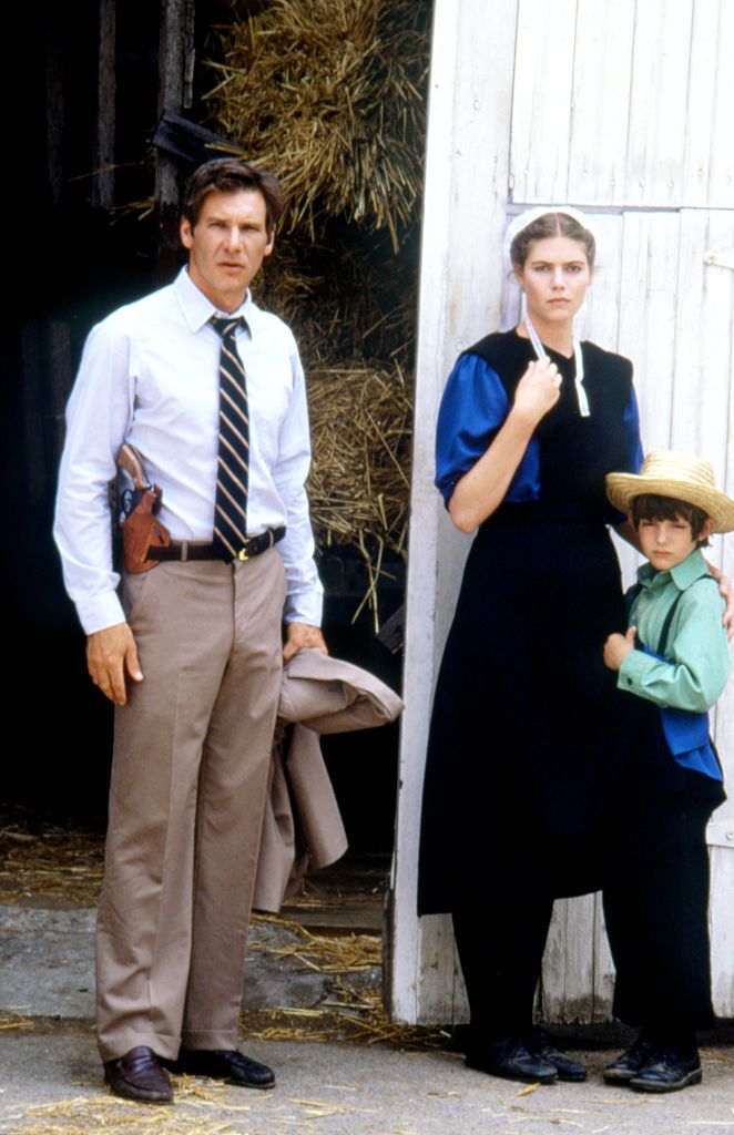 American actors Harrison Ford, Kelly McGillis and Lukas Haas on the set of Witness directed by Peter Weir. (Photo by Sunset Boulevard/Corbis via Getty Images)