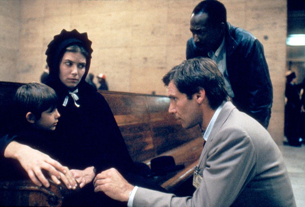 American actors Lukas Haas, Kelly McGillis and Harrison Ford on the set of Witness directed by Peter Weir. (Photo by Sunset Boulevard/Corbis via Getty Images)