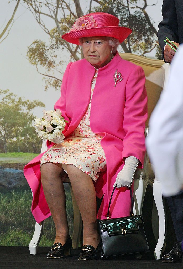 MELBOURNE, AUSTRALIA - OCTOBER 26:  Queen Elizabeth II holds her handbag at the new Royal Childrenâs Hospital on October 26, 2011 in Melbourne, Australia. The Queen and Duke of Edinburgh are on a 10-day visit to Australia and will travel to Canberra, Brisbane, and Melbourne before heading to Perth for the Commonwealth Heads of Government meeting. This is the Queen's 16th official visit to Australia.  (Photo by Scott Barbour/Getty Images)