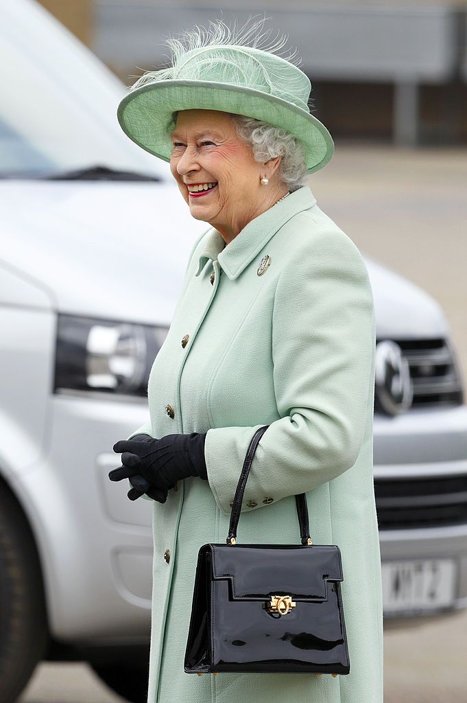 WOOLWICH, UNITED KINGDOM - MAY 31: (EMBARGOED FOR PUBLICATION IN UK NEWSPAPERS UNTIL 48 HOURS AFTER CREATE DATE AND TIME) Queen Elizabeth II arrives for a visit to The King's Troop Royal Horse Artillery unit at Woolwich Barracks on May 31, 2013 in Woolwich, England. (Photo by Max Mumby/Indigo/Getty Images)