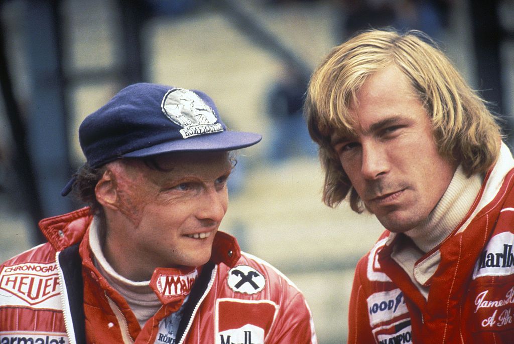 Niki Lauda of Austria, driver of the #11Scuderia Ferrari SpA Ferrari 312T2 Ferrari flat-12 talks to rival James Hunt, driver of the #1 MarlboroTeam McLaren M26 Ford V8 before the start of the Belgian Grand Prix on 5th June 1977 at the Circuit Zolder in Limburg, Belgium. (Photo by Grand Prix Photo/Getty Images)
