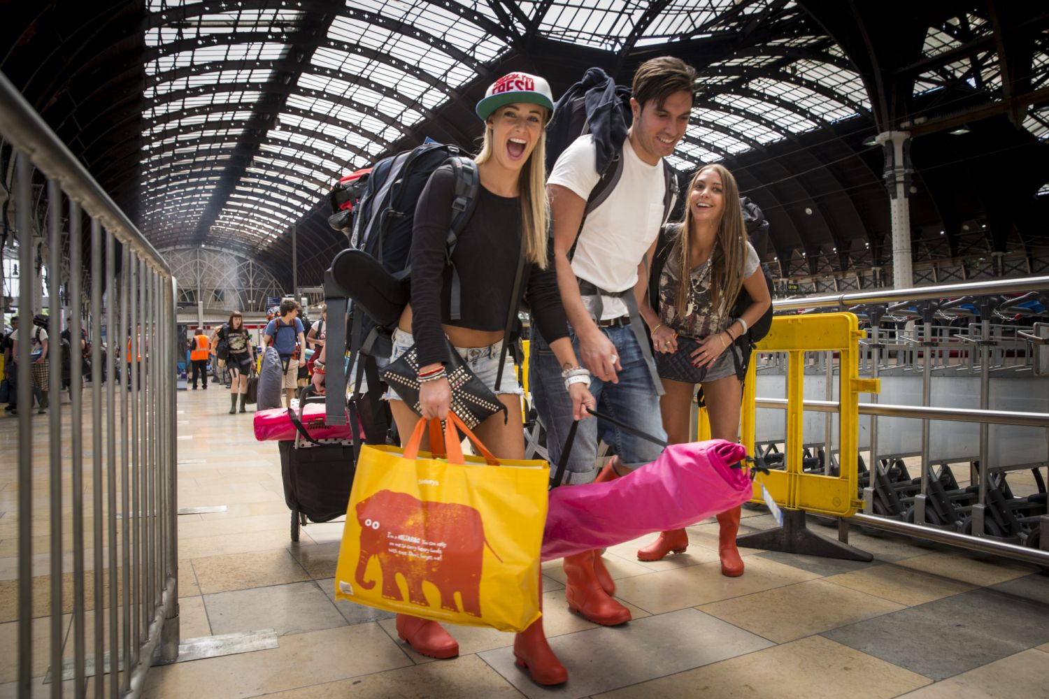 LONDON, ENGLAND - JUNE 25: Festival goers board trains at Paddington station to travel to Castle Cary station for the first day of the 2014 Glastonbury Festival on June 25, 2014 in London, England. Gates opened today at the Somerset dairy farm that plays host to one of the largest music festivals in the world. Tickets to the event, which is now in its 44th year, sold out in minutes even before any of the headline acts had been confirmed. The festival, which started in 1970 when several hundred hippies pai