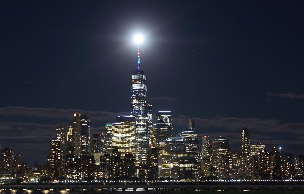 JERSEY CITY, NJ - JUNE 24: The Super Strawberry Moon rises above the skyline of lower Manhattan and One World Trade Center in New York City on June 24, 2021 as seen from Jersey City, New Jersey. (Photo by Gary Hershorn/Getty Images)