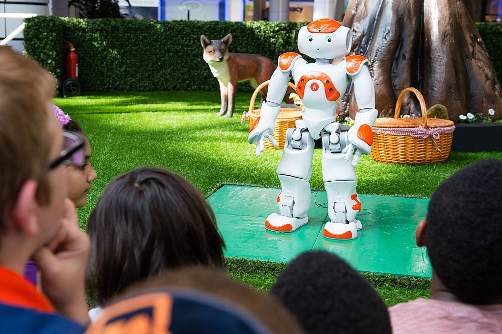 LONDON, ENGLAND - AUGUST 10: Alexander the friendly robot visits the Indoor Park to interact with children by telling classic fairy tales, singing and dancing at Westfield London on August 10, 2016 in London, England. (Photo by Jeff Spicer/Getty Images for Westfield)