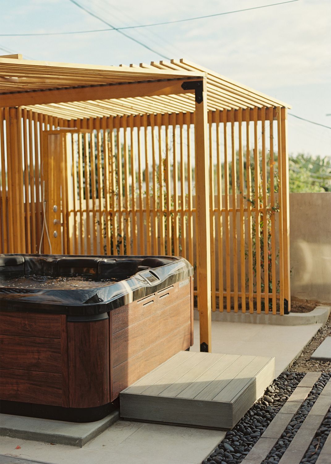 A hot tub within the outdoor spa area allows one to rejuvenate and soak in the views