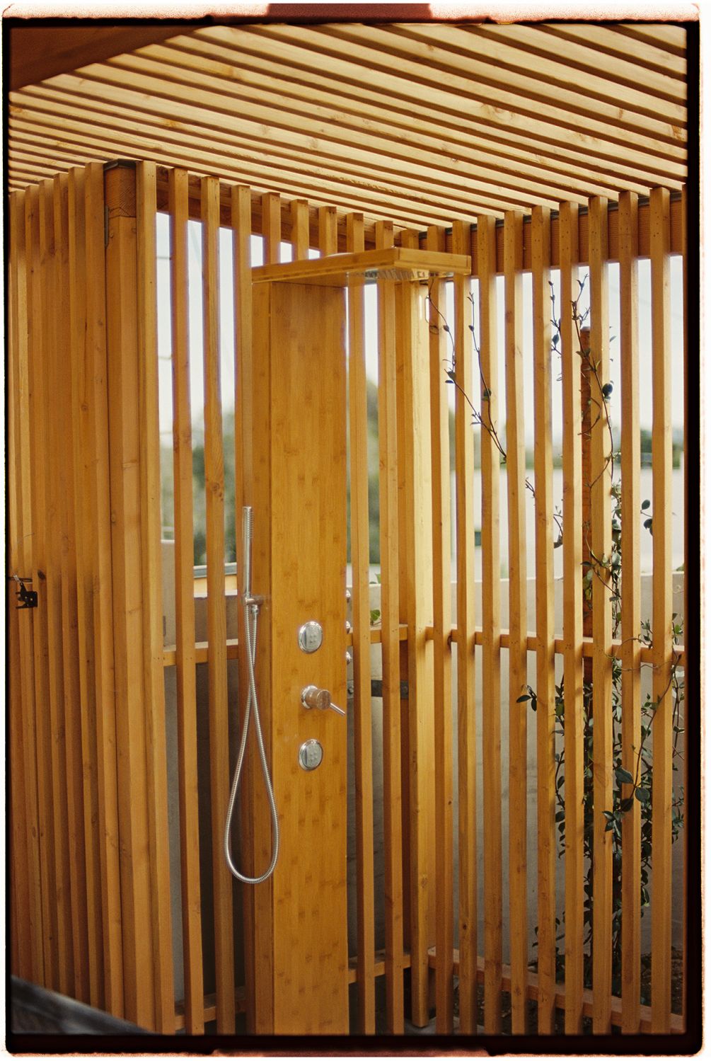 The wooden slats offer privacy and shade while allowing natural light to filter though