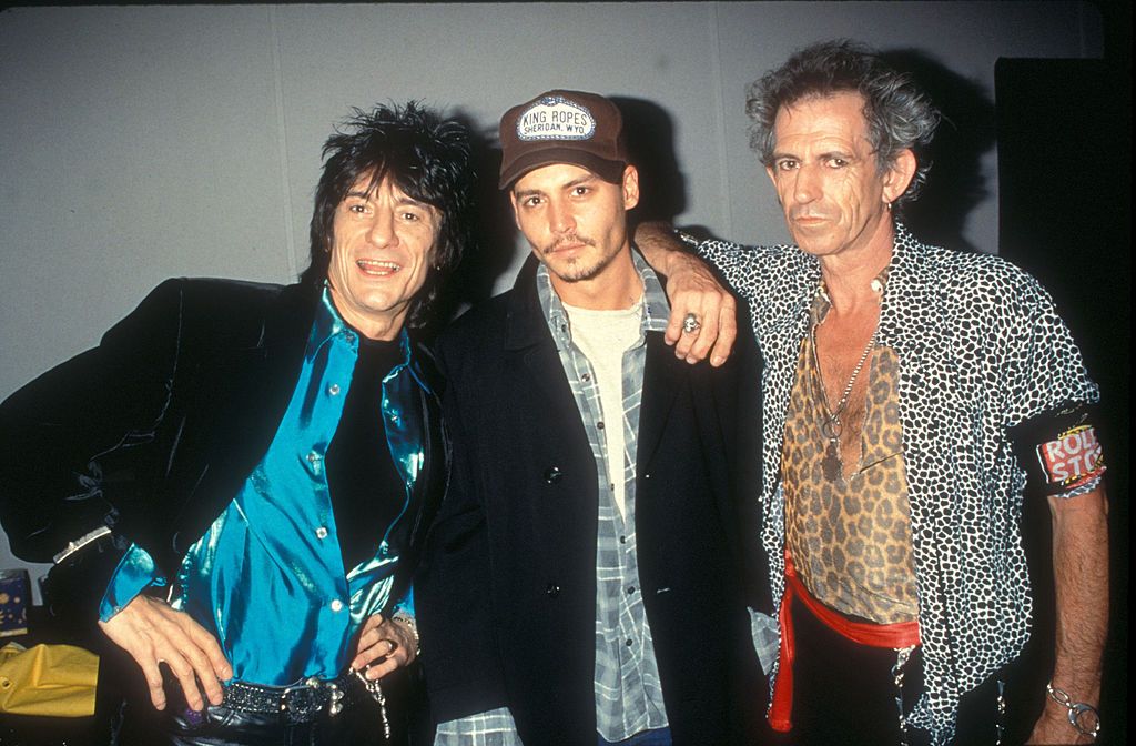 Johnny Depp (center) with Ron Wood and Keith Richards of the Rolling Stones (Photo by Ke.Mazur/WireImage)