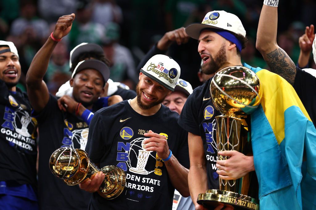BOSTON, MASSACHUSETTS - JUNE 16: Stephen Curry #30 and Klay Thompson #11 of the Golden State Warriors celebrate after defeating the Boston Celtics 103-90 in Game Six of the 2022 NBA Finals at TD Garden on June 16, 2022 in Boston, Massachusetts. NOTE TO USER: User expressly acknowledges and agrees that, by downloading and/or using this photograph, User is consenting to the terms and conditions of the Getty Images License Agreement. (Photo by Elsa/Getty Images)