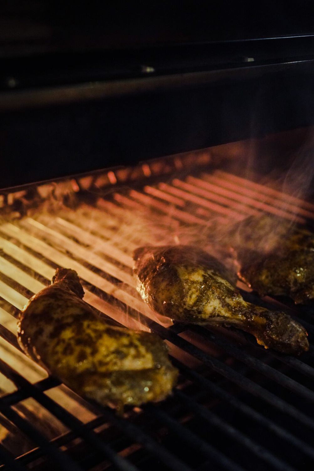 Herbs & spices quarter chicken on the flames from the Josper Grill.