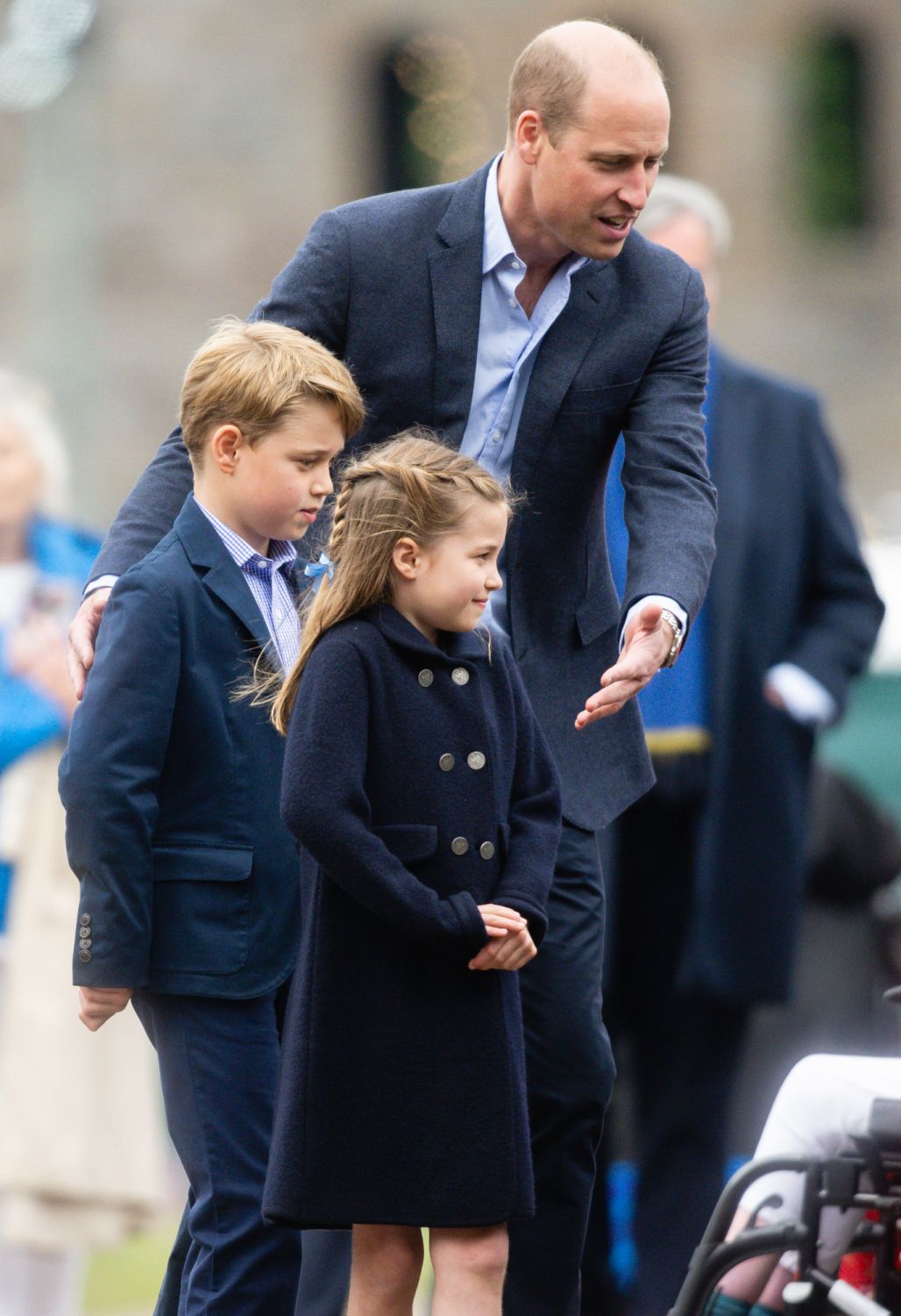 As Prince William continues to introduce his children to the public life of the royal family, he is always right there to guide them through the overwhelming moments such as during a visit to Cardiff Castle in June this year. (Photo: Getty Images)