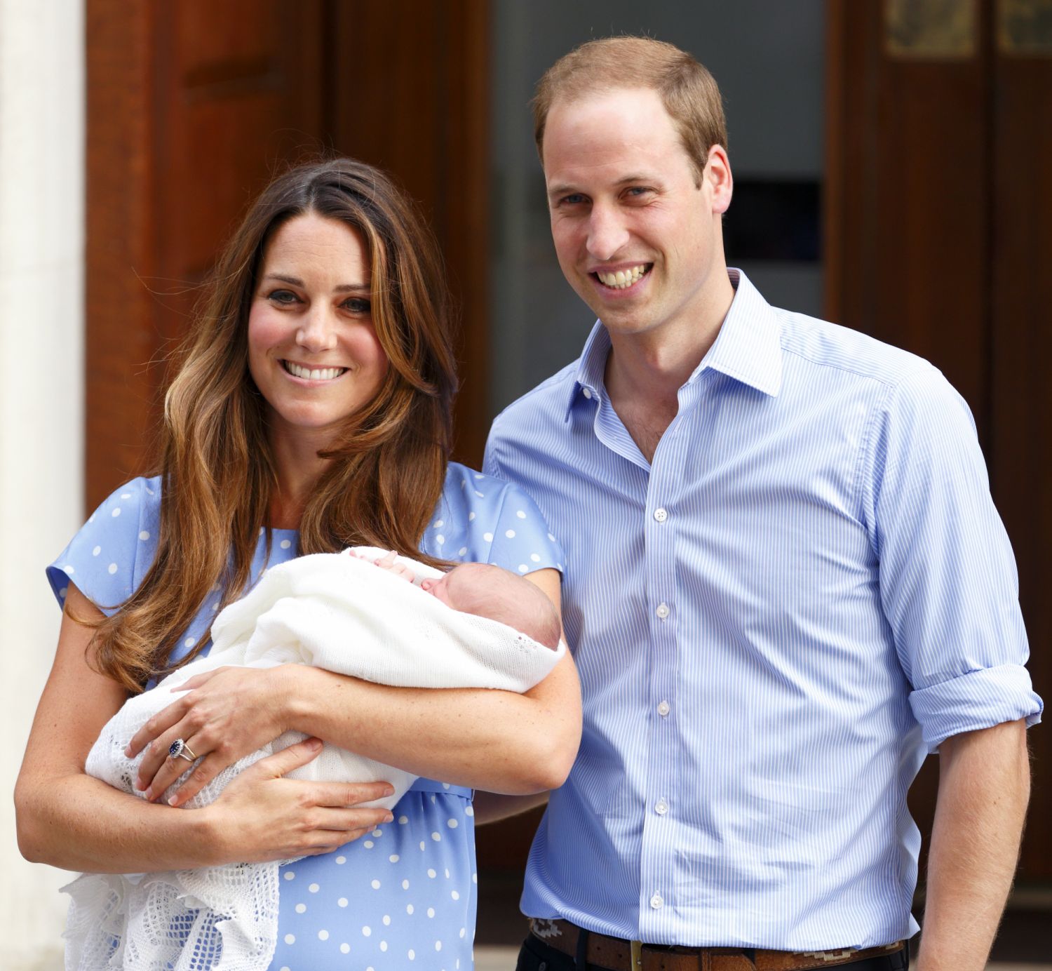 Catherine and Prince William leave The Lindo Wing with their newborn son, Prince George. Prince William is seen beaming proudly at the birth of the first of three children. (Photo: Getty)