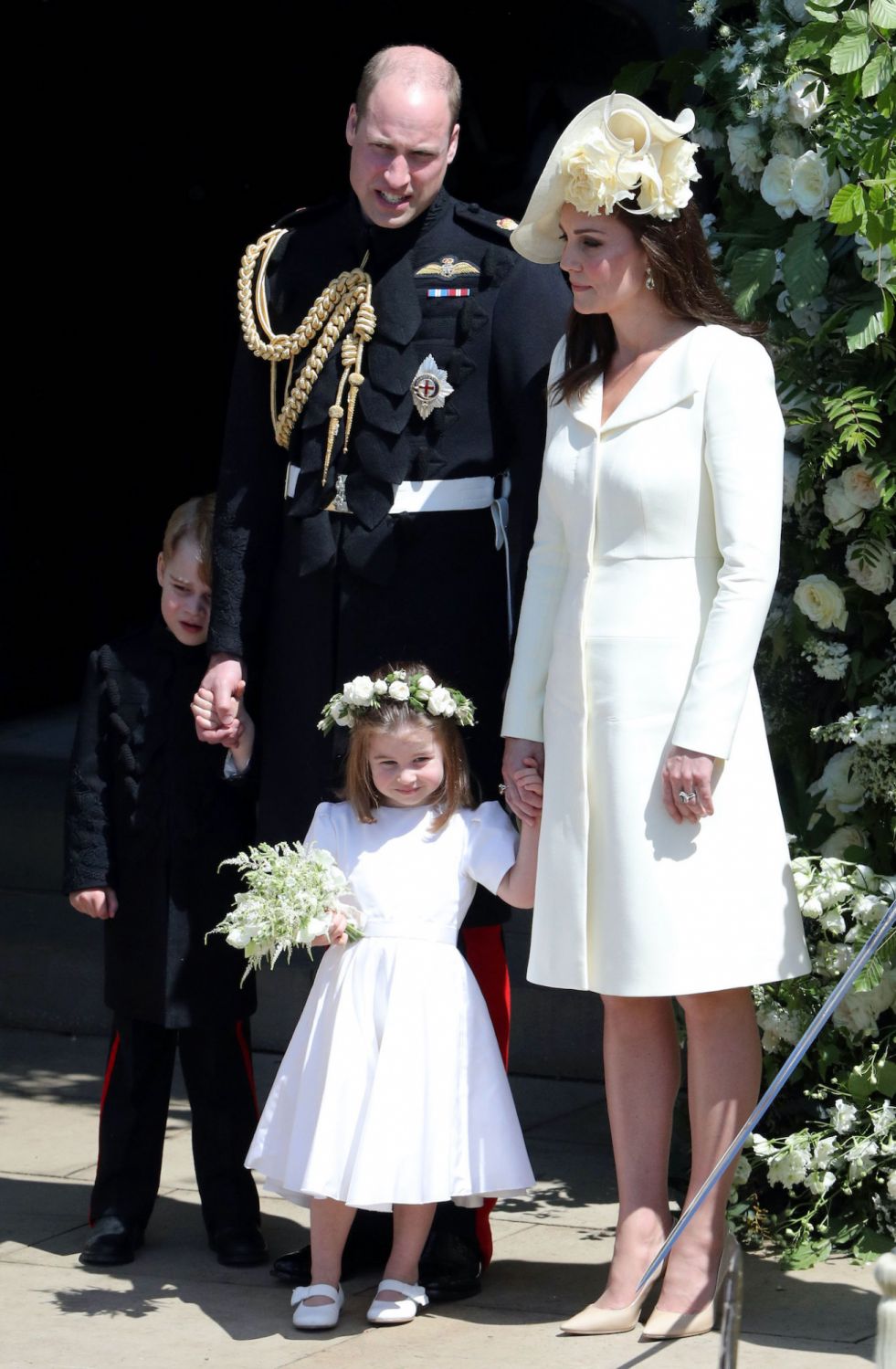 The Duke and Duchess of Cambridge with Prince George and Princess Charlotte leave St George's Chapel in Windsor Castle after the wedding. PRESS ASSOCIATION Photo. Picture date: Saturday May 19, 2018. See PA story ROYAL Wedding. Photo credit should read: Andrew Matthews/PA Wire