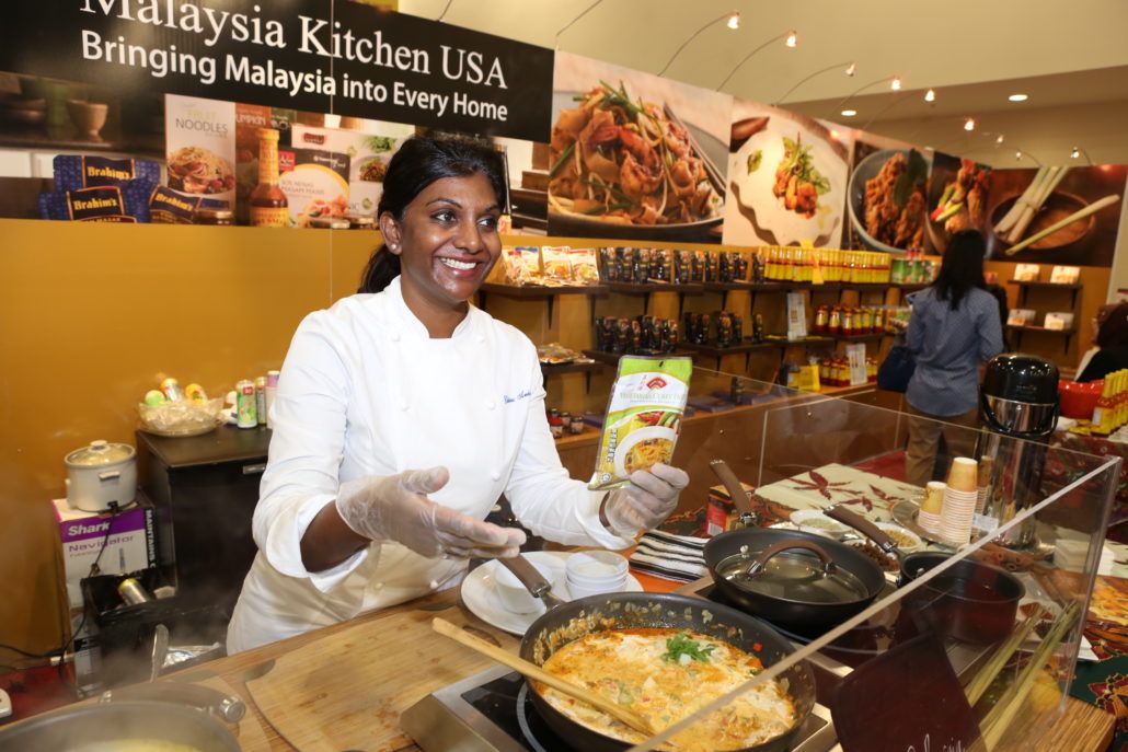 Arokiasamy cooking during an Introducing Malaysian Food To Miami event in Miami, Florida