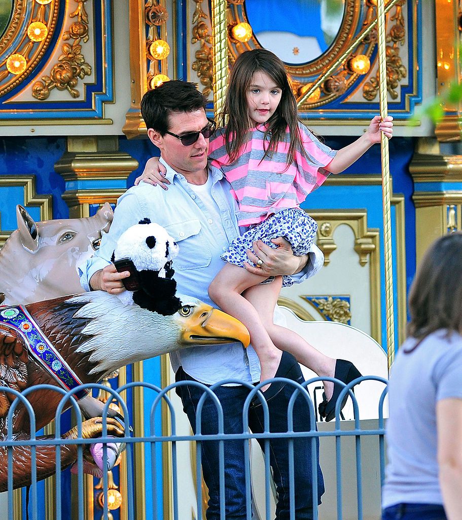 PITTSBURGH, PA - OCTOBER 08: Tom Cruise and Suri Cruise visit Schenley Plaza's carousel on October 8, 2011 in Pittsburgh, Pennsylvania. (Photo by James Devaney/WireImage)