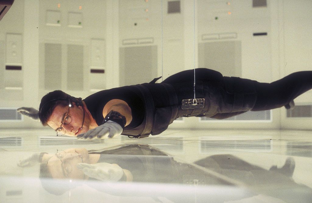 American actor Tom Cruise as Ethan Hunt in a scene from the film 'Mission: Impossible', 1996. Here he steals the NOC list from the CIA headquarters in Langley. (Photo by Murray Close/Getty Images)