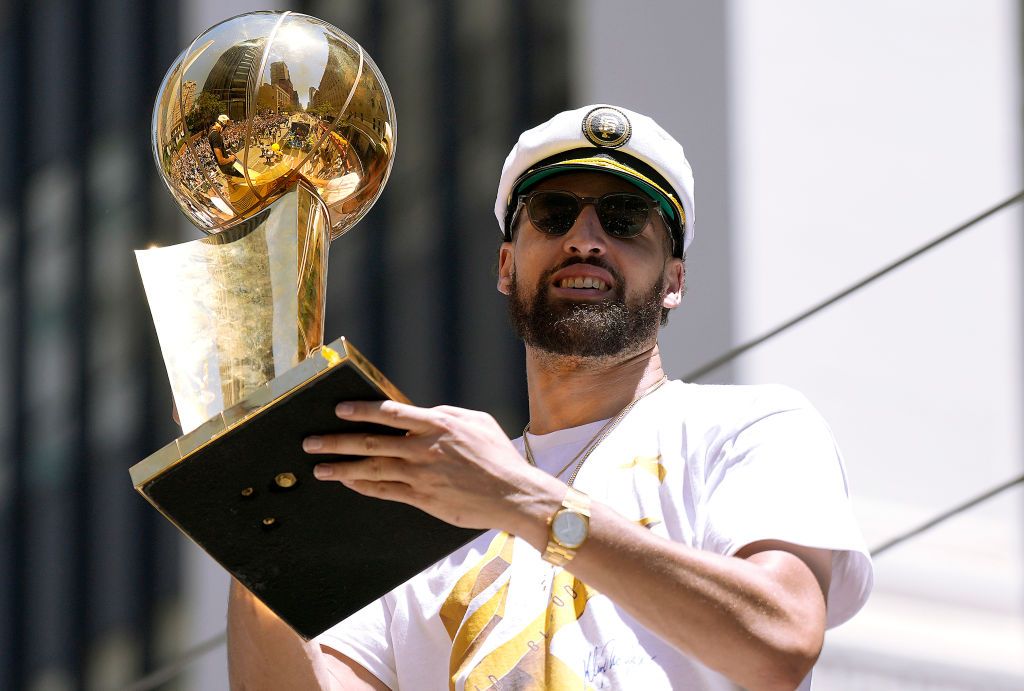 SAN FRANCISCO, CALIFORNIA - JUNE 20: Klay Thompson #11 of the Golden State Warriors celebrates with the NBA Championship Trophy during the Golden State Warriors Victory Parade on June 20, 2022 in San Francisco, California. The Golden State Warriors beat the Boston Celtics 4-2 to win the 2022 NBA Finals. NOTE TO USER: User expressly acknowledges and agrees that, by downloading and or using this photograph, User is consenting to the terms and conditions of the Getty Images License Agreement. (Photo by Thearon