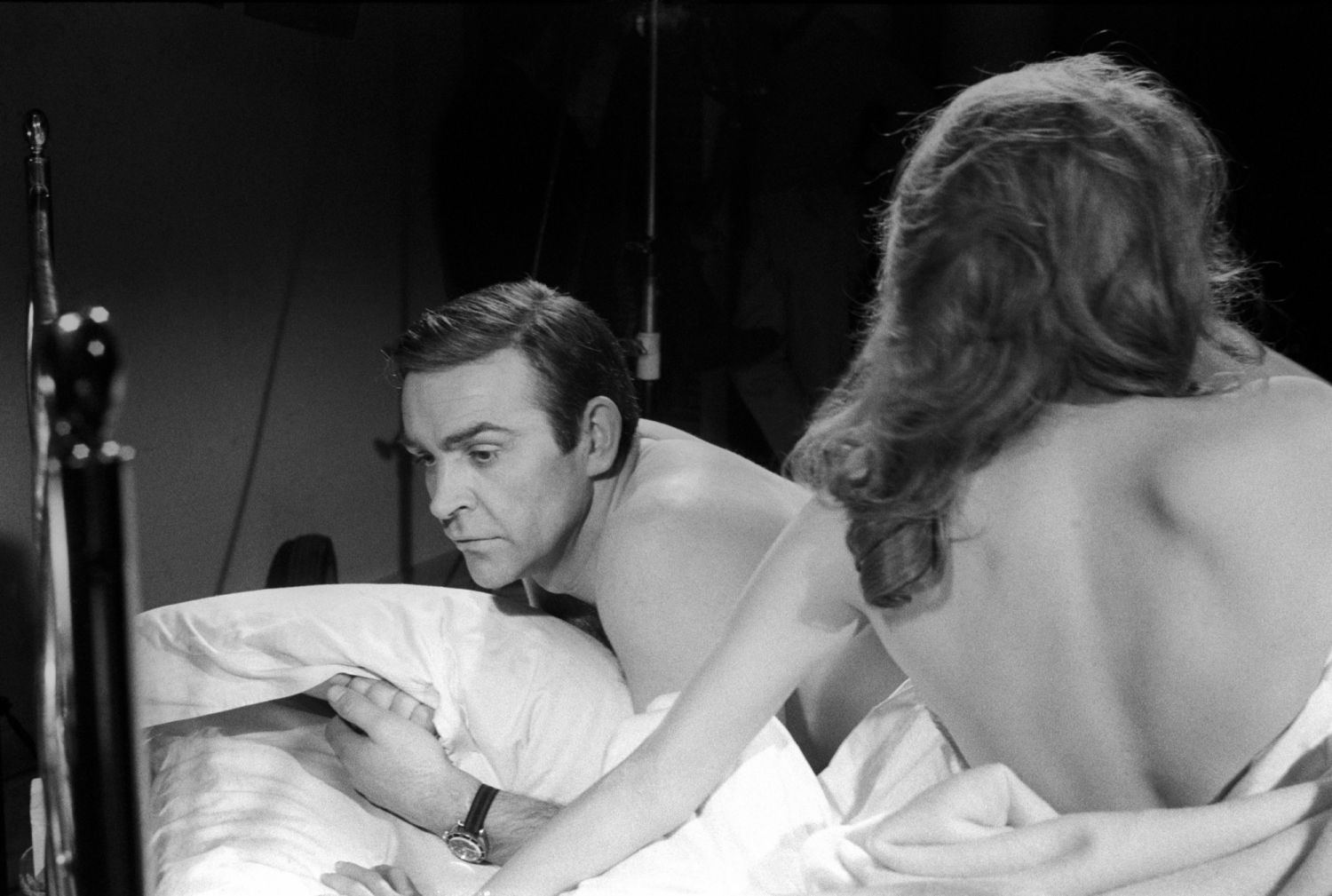 The actors Sean Connery and Luciana Paluzzi, in bed, are preparing themselves to shoot a hot scene from the movie Thunderball, fourth episode of secret agent 007's series. Pinewood (London), march 1965. (Photo by Mario De Biasi/Mondadori via Getty Images)