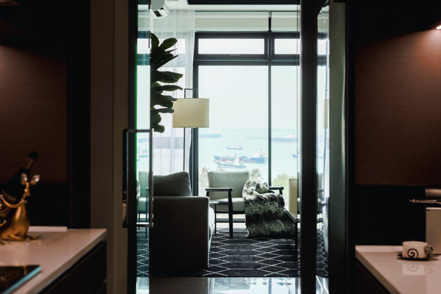 Expansive glass windows help to bring the outdoors into the home