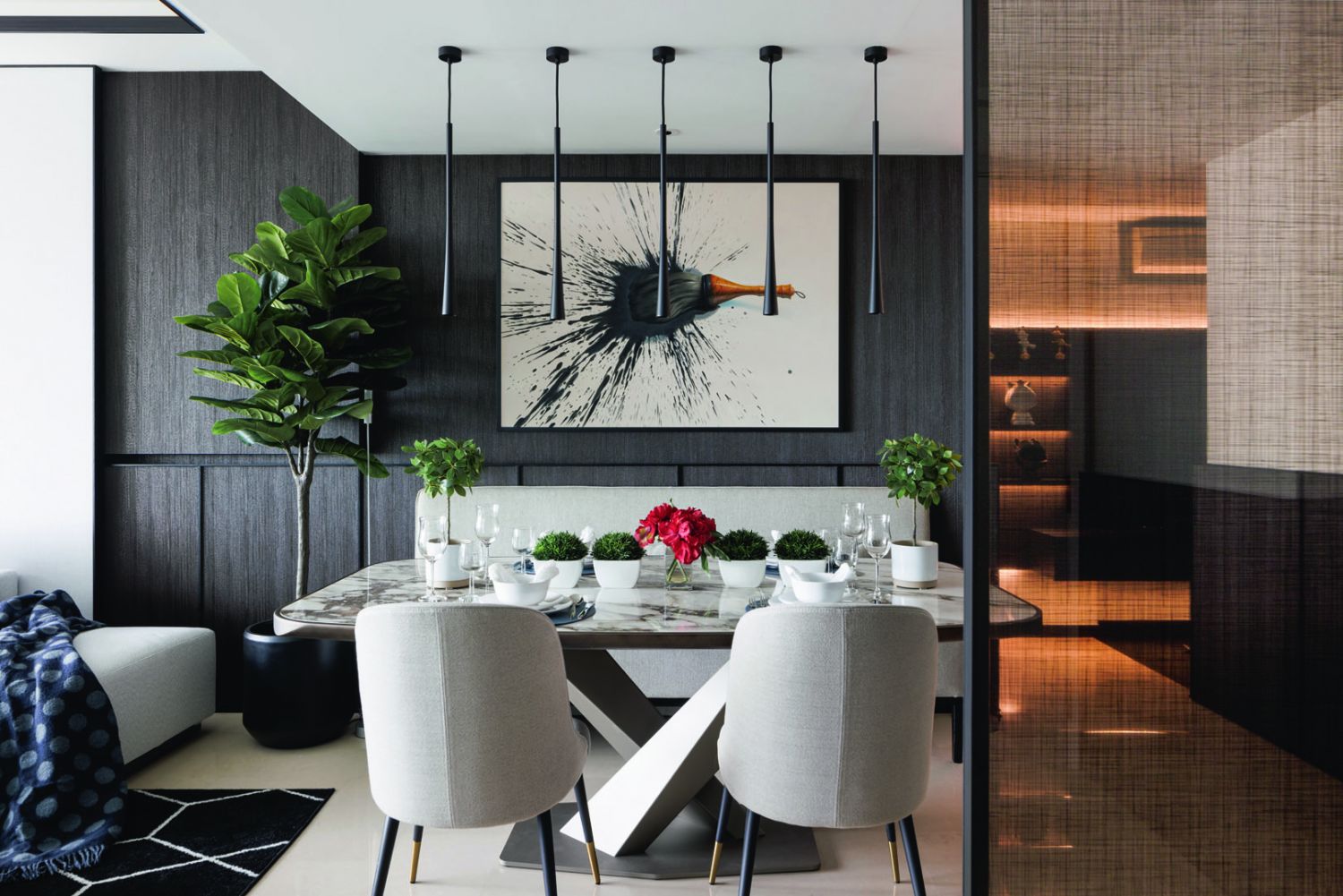 These minimalist pendant lamps in the dining area match the apartment’s clean-lined scheme