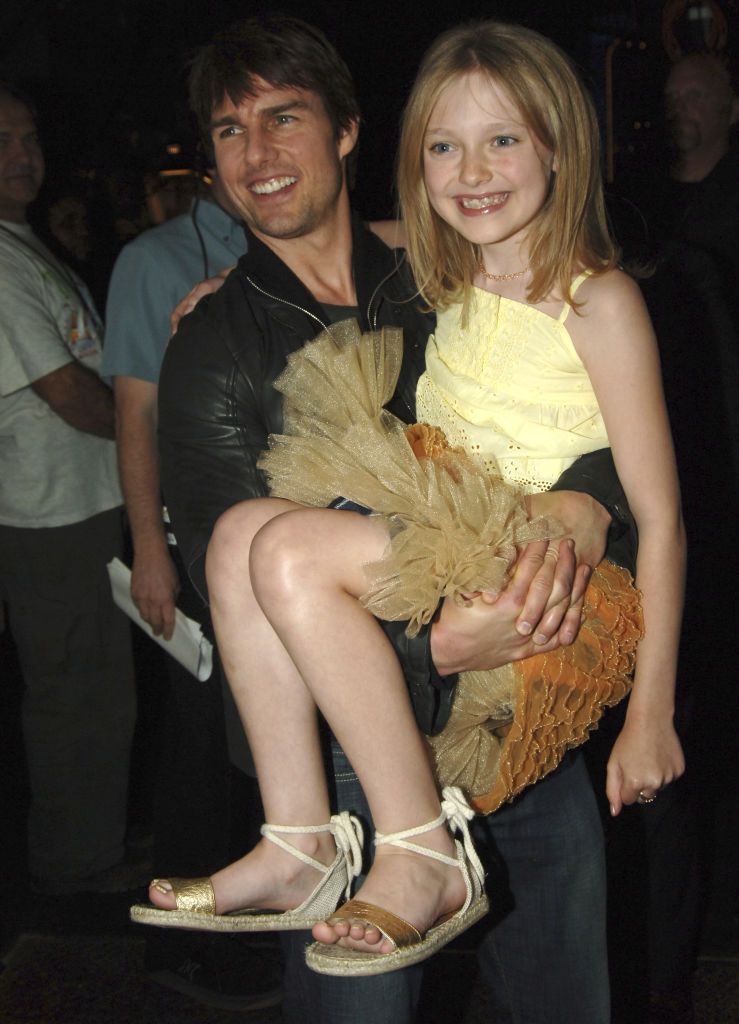 Tom Cruise and Dakota Fanning during 2005 MTV Movie Awards - Backstage and Audience at Shrine Auditorium in Los Angeles, California, United States. (Photo by Jeff Kravitz/FilmMagic)