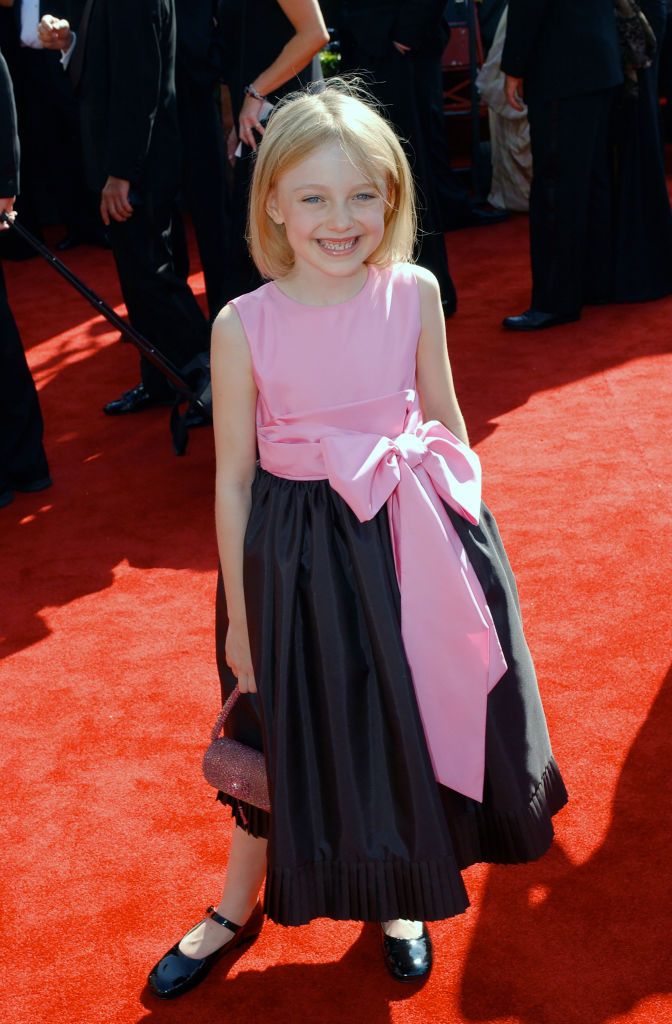LOS ANGELES, CALIFORNIA - SEPTEMBER 21 : Dakota Fanning arrives at Emmy Awards Show, September 21, 2003 in Los Angeles, California. (Photo by Getty Images/Bob Riha, Jr.)