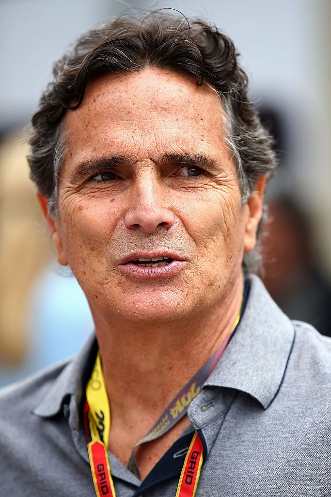SAO PAULO, BRAZIL - NOVEMBER 09: Former Brazilian F1 driver Nelson Piquet looks on in the paddock before the Brazilian Formula One Grand Prix at Autodromo Jose Carlos Pace on November 9, 2014 in Sao Paulo, Brazil. (Photo by Mark Thompson/Getty Images)