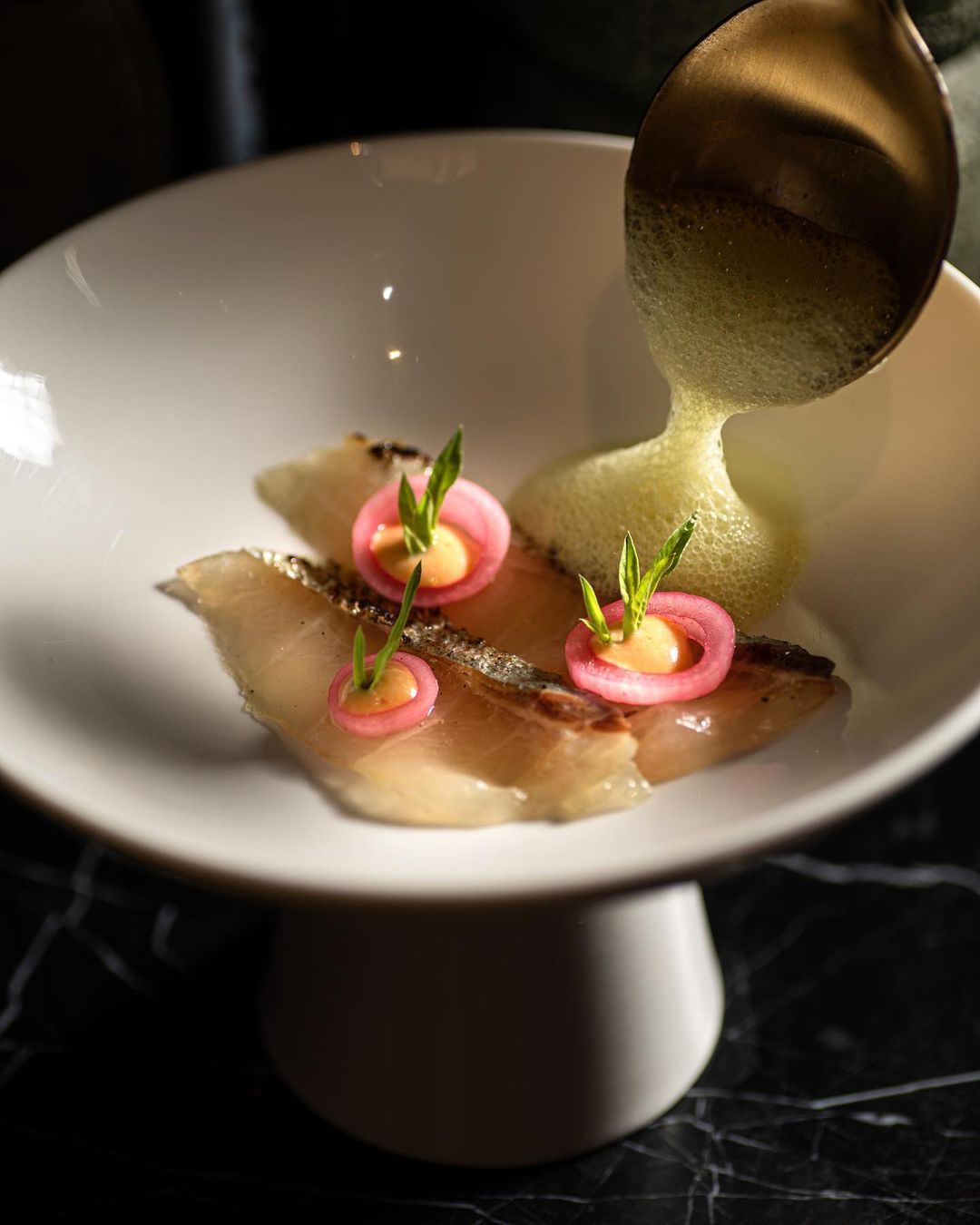Cured striped jack simmered in a spice turmeric and tamarind broth (Photo: @beta.kl/Instagram)