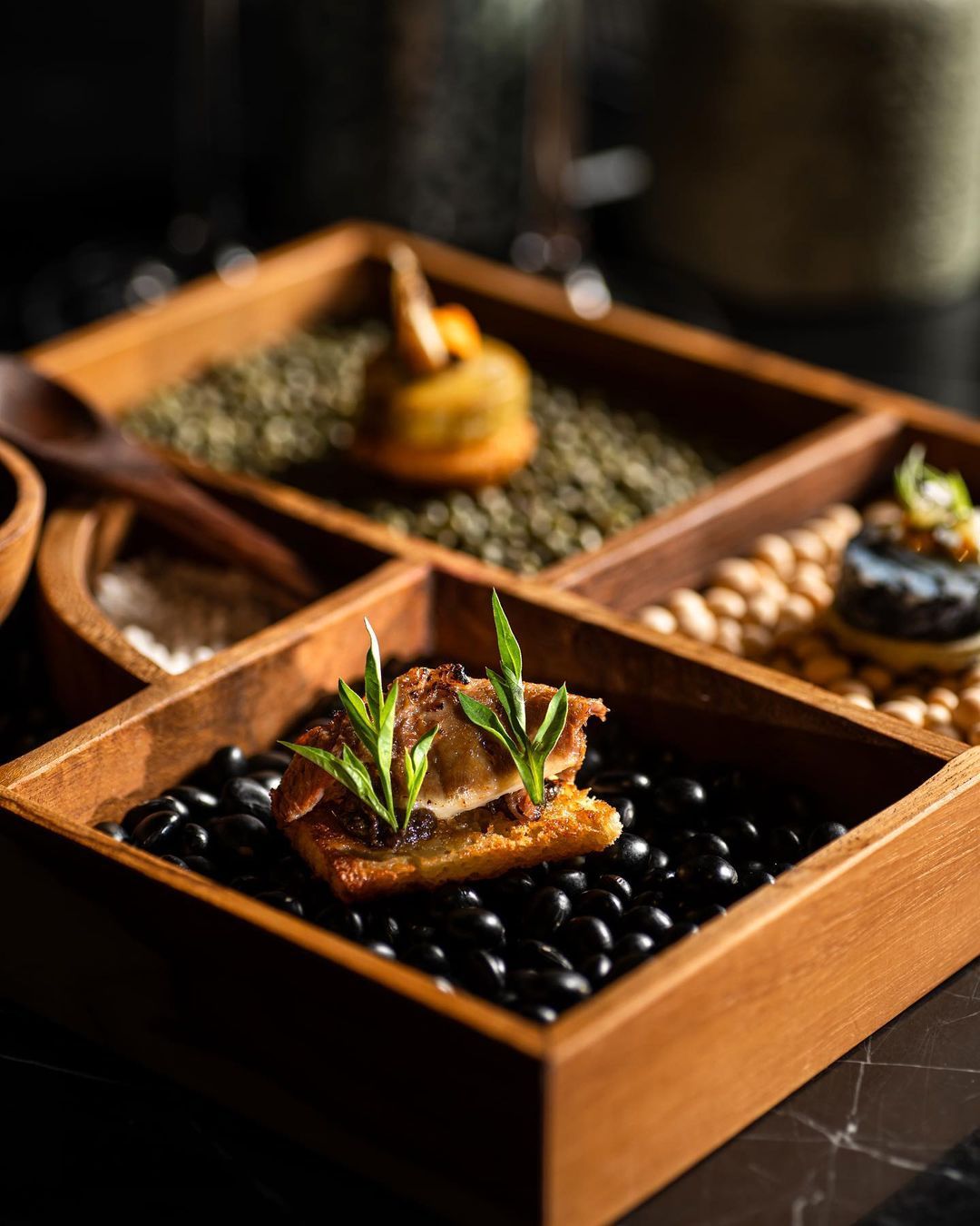 Char-grilled ox-tongue with buah keluak purée on toast (Photo: @beta.kl/Instagram)