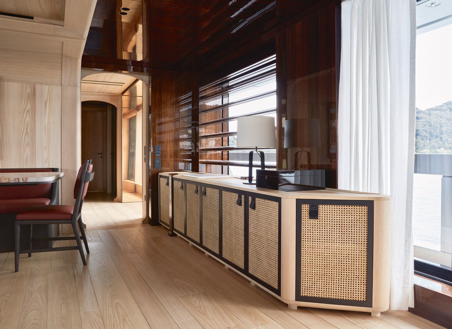Rattan cabinet doors are among the subtle references to the modern Asian influences on this superyacht designed by Studio Liaigre