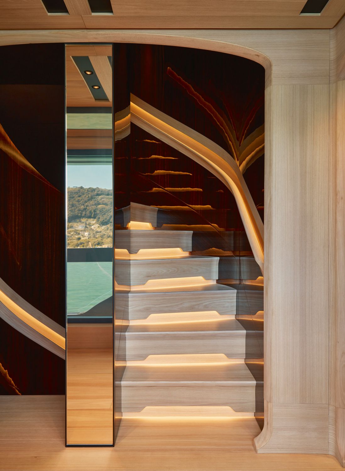 Backlit steps and handles turn the staircase into a sculptural object
