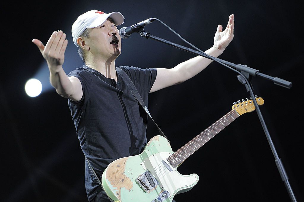 TIANJIN, CHINA - AUGUST 24:  (CHINA OUT) Cui Jian aka "The Father of Chinese Rock" performs on stage at Evergrande Starlight Carnival Music Festival on August 24, 2014 in Tianjin, China.  (Photo by Visual China Group via Getty Images/Visual China Group via Getty Images)