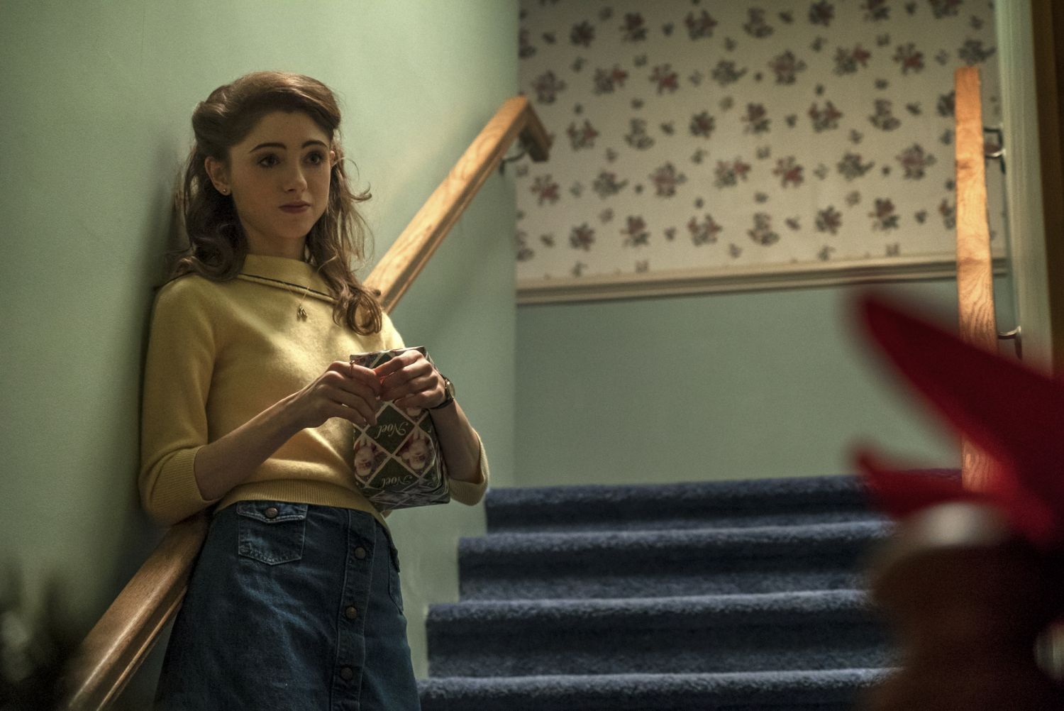 Nancy's simple yellow top paired with the skirt is a simple chic look we love
