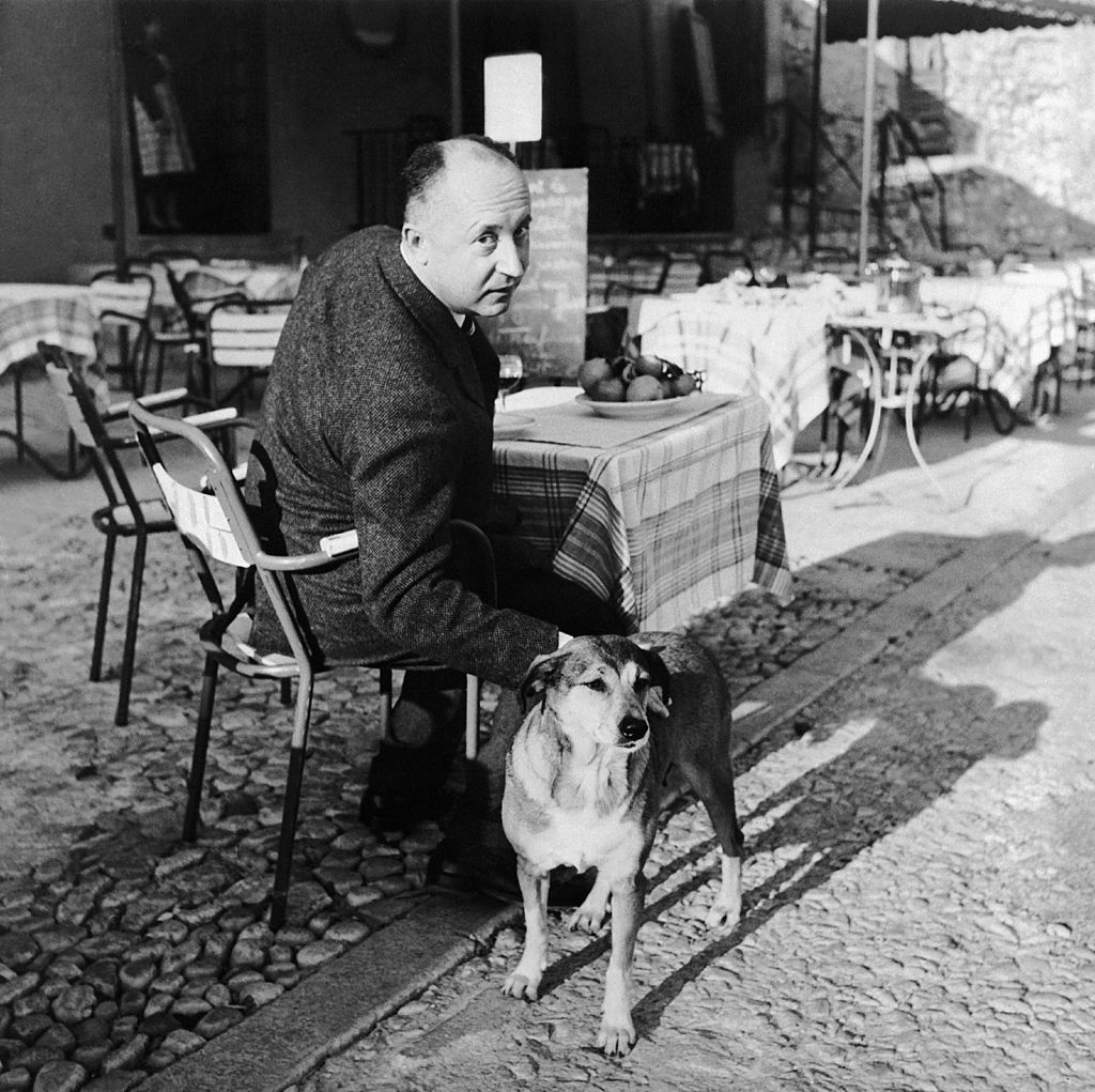 FRANCE - JANUARY 01: The French Fashion Designer Christian Dior Petting His Favorite Dog, France, circa 1955-1957. (Photo by Keystone-France/Gamma-Keystone via Getty Images)