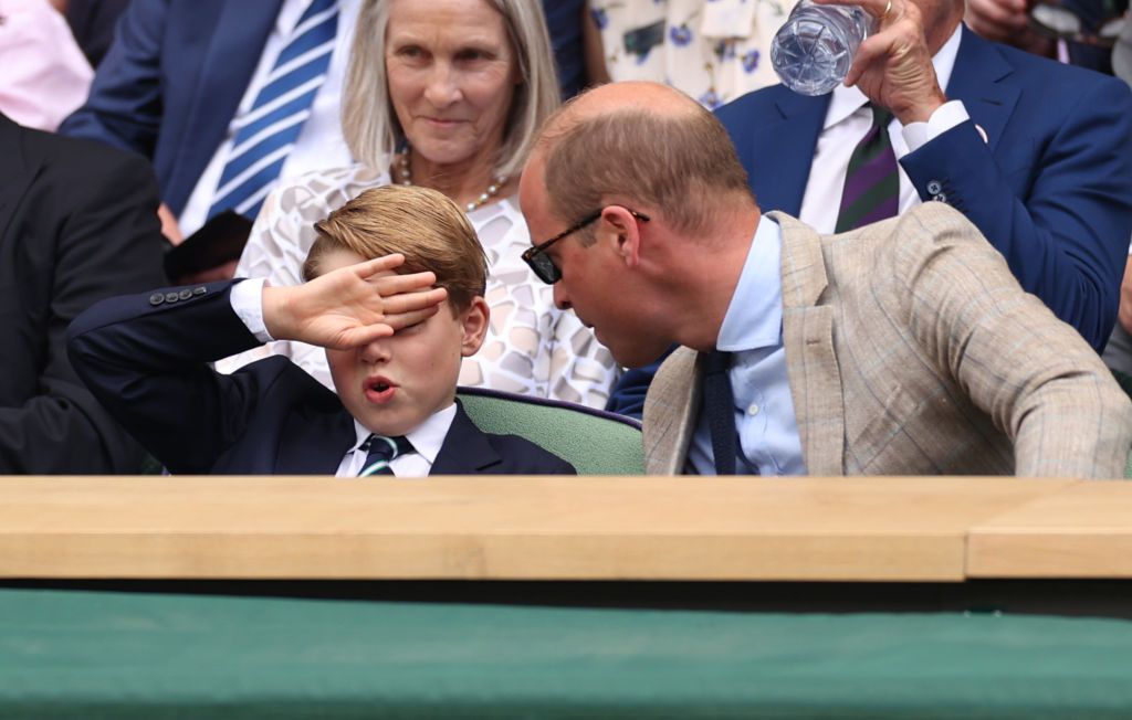 LONDON, ENGLAND - JULY 10: Prince William, Duke of Cambridge (R) and Prince George of Cambridge interact in the Royal Box watching Novak Djokovic of Serbia play Nick Kyrgios of Australia during their Men's Singles Final match on day fourteen of The Championships Wimbledon 2022 at All England Lawn Tennis and Croquet Club on July 10, 2022 in London, England. (Photo by Ryan Pierse/Getty Images)