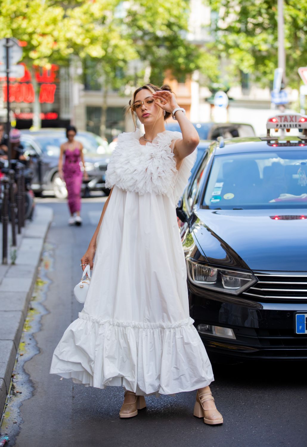 PARIS, FRANCE - JULY 06: Eileen Vu seen with pigtails wearing white dress outside Viktor&Rolf during Paris Fashion Week - Haute Couture Fall Winter 2022 2023 : Day Three on July 06, 2022 in Paris, France. (Photo by Christian Vierig/Getty Images)