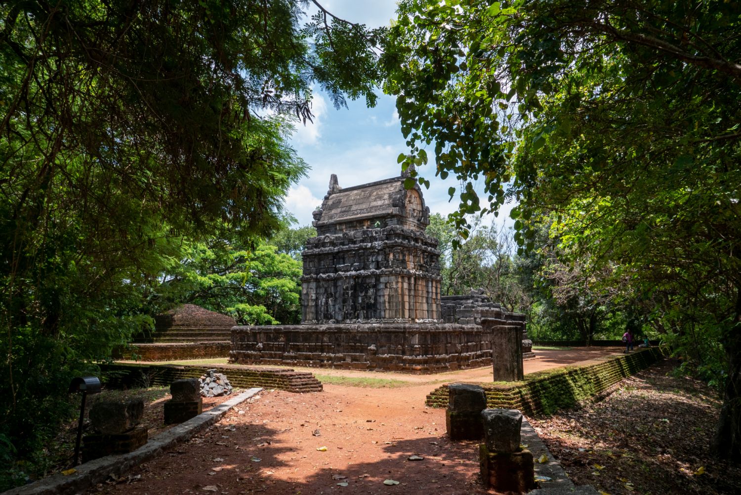 Lush greenery surrounds Nalanda Gedige, one of the earliest stone structures in Sri Lanka near the city of Matale
