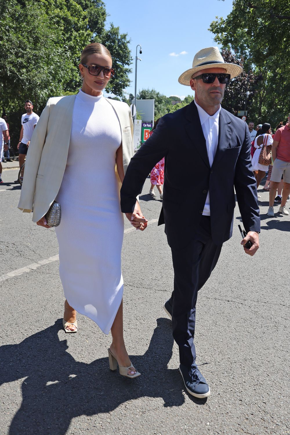 LONDON, ENGLAND - JULY 10: Jason Statham and Rosie Huntington Whiteley arrive for Men's Singles Final Day at All England Lawn Tennis and Croquet Club on July 10, 2022 in London, England. (Photo by Neil Mockford/GC Images)