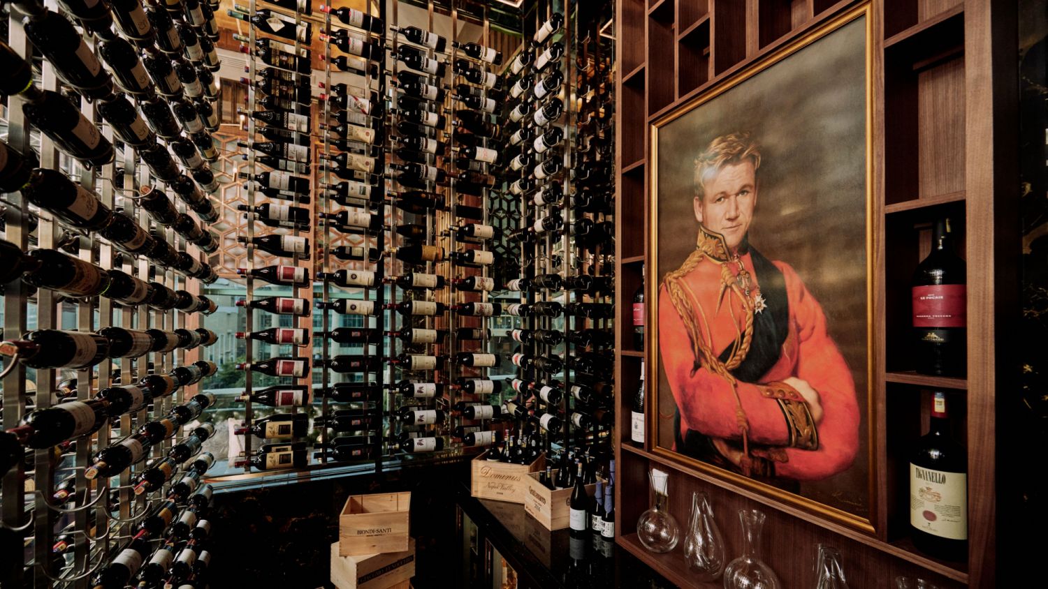 A portrait of Ramsay overlooks the bottles of wine.