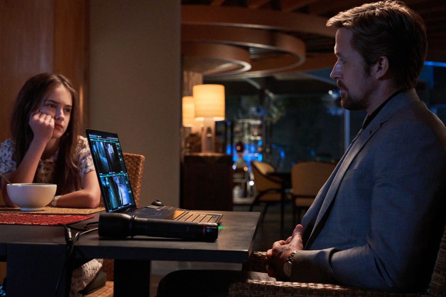 The Gray Man (2022). (L - R) Julia Butters as Claire, Ryan Gosling as Six. Cr. Paul Abell/Netflix © 2022