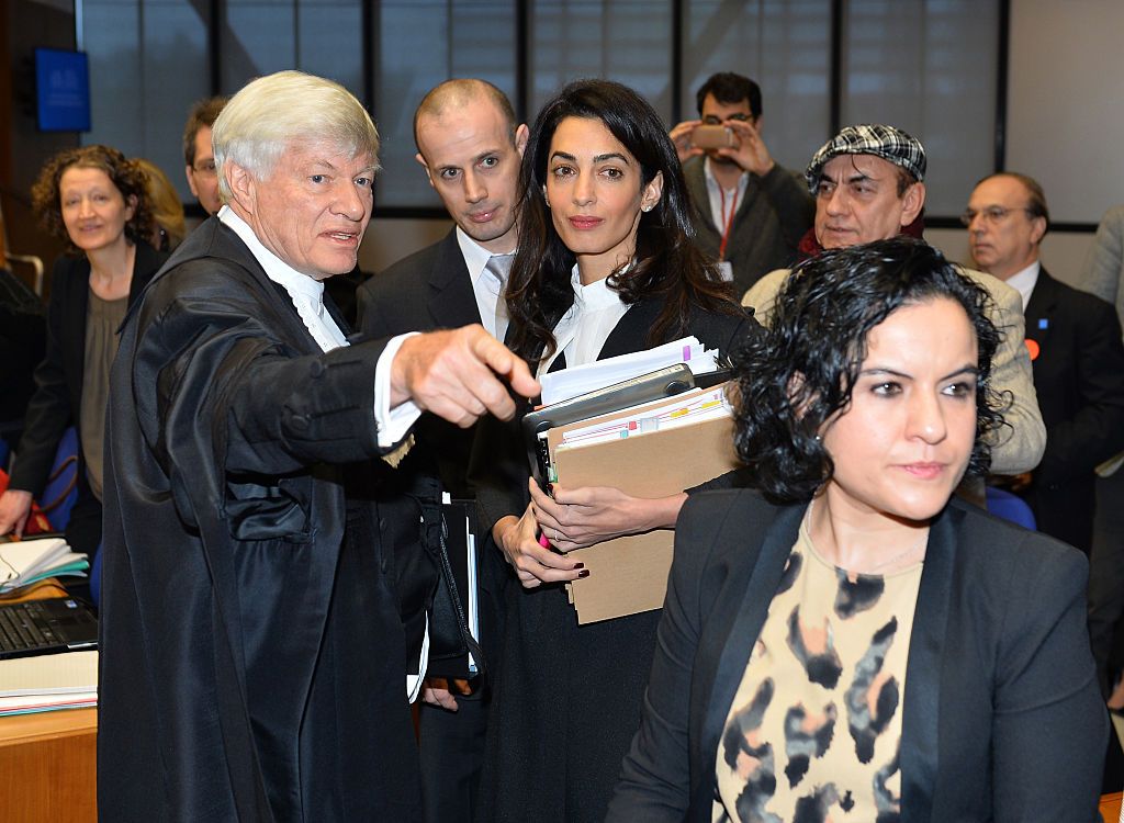 STRASBOURG, FRANCE - JANUARY 28: Lawyer Amal Alamuddin Clooney (C) arrives for the hearing in the case Perincek vs Switzerland, at the European Court of Human Rights (ECHR) in Strasbourg, France on January 28, 2015. The European Court of Human Rights holds a Grand Chamber Hearing in the case between Turkish national and Chairman of Turkish Workers' Party Dogu Perincek and Switzerland concerning freedom of expression. Perincek found guilty of racial discrimination in Switzerland for describing so-called Arme