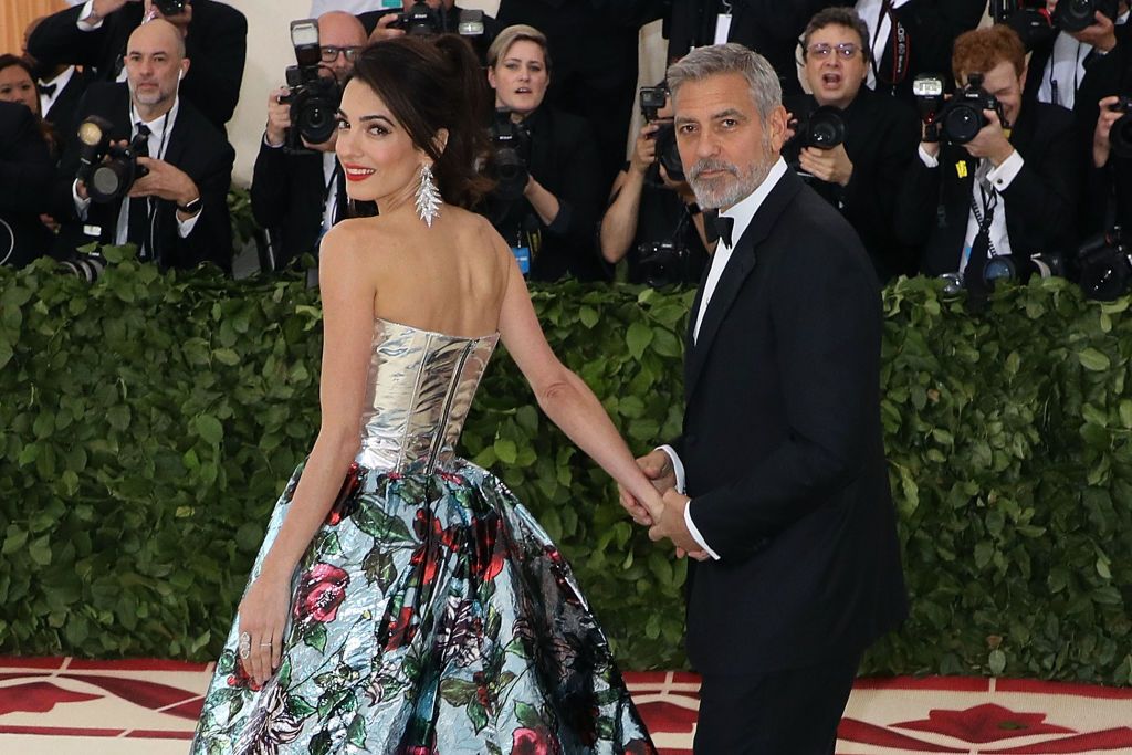 NEW YORK, NY - MAY 07:  Amal Clooney and George Clooney attend "Heavenly Bodies: Fashion & the Catholic Imagination", the 2018 Costume Institute Benefit at Metropolitan Museum of Art on May 7, 2018 in New York City.  (Photo by Taylor Hill/Getty Images)