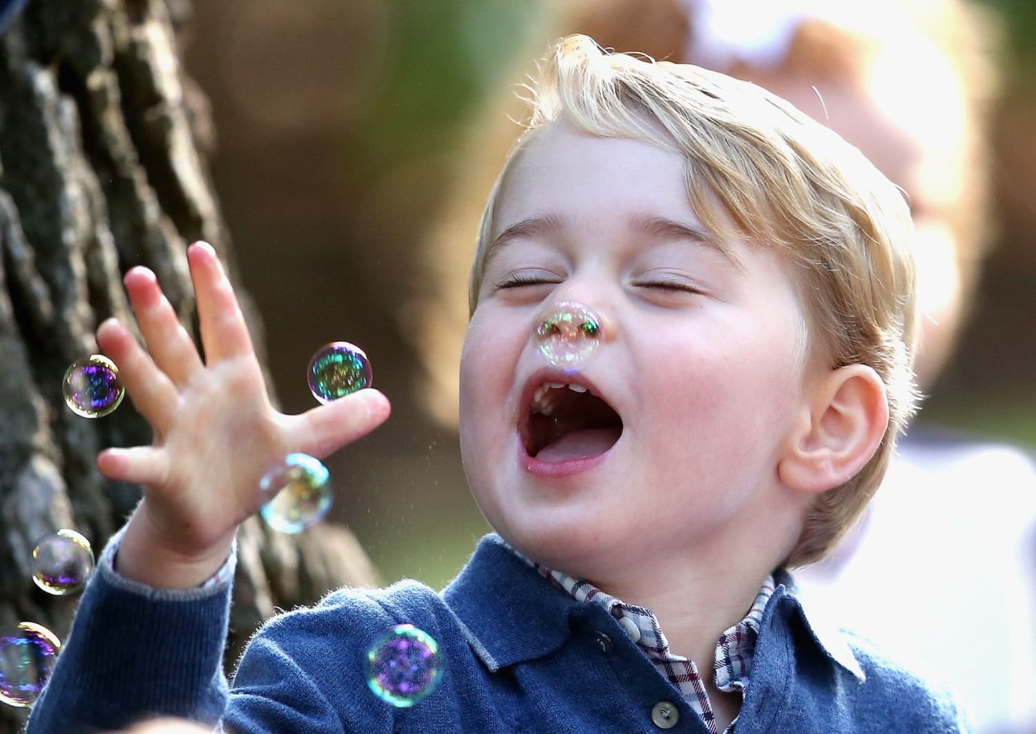 VICTORIA, BC - SEPTEMBER 29:  Prince George of Cambridge plays with bubbles at a children's party for Military families during the Royal Tour of Canada on September 29, 2016 in Carcross, Canada. Prince William, Duke of Cambridge, Catherine, Duchess of Cambridge, Prince George and Princess Charlotte are visiting Canada as part of an eight day visit to the country taking in areas such as Bella Bella, Whitehorse and Kelowna  (Photo by Chris Jackson/Getty Images) *** Local Caption *** Prince George