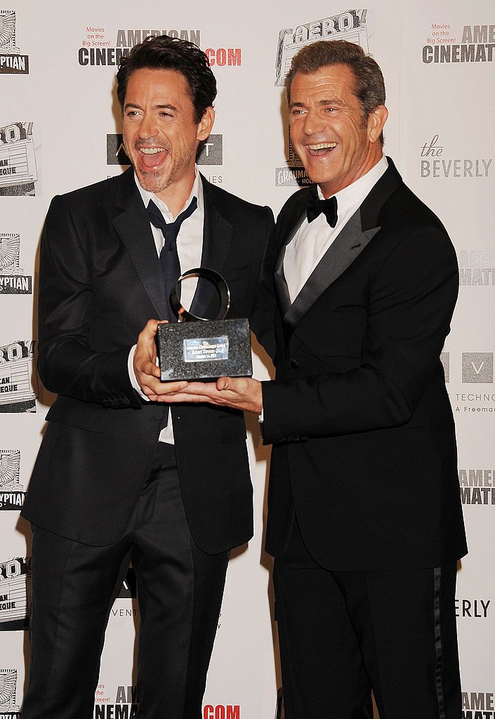 Robert Downey, Jr. and Mel Gibson pose the The 25th American Cinematheque Award Honoring Robert Downey Jr. at The Beverly Hilton hotel on October 14, 2011 in Beverly Hills, California.