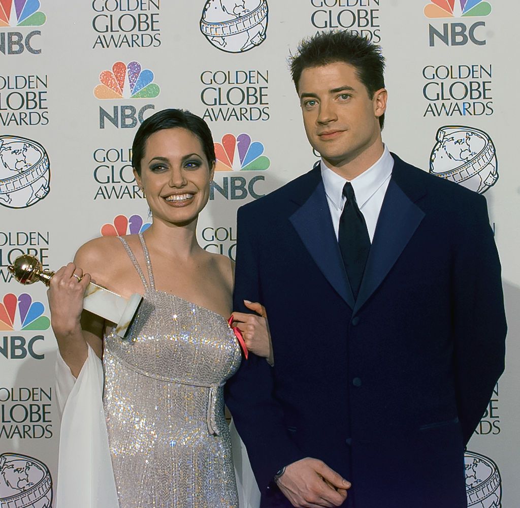 BEVERLY HILLS, CALIFORNIA - JANUARY 19: Winner Angelina Jolie with Brendan Fraser backstage at Golden Globe Awards Show, January 19, 1997 in Beverly Hills, California. (Photo by Bob Riha, Jr./Getty Images)