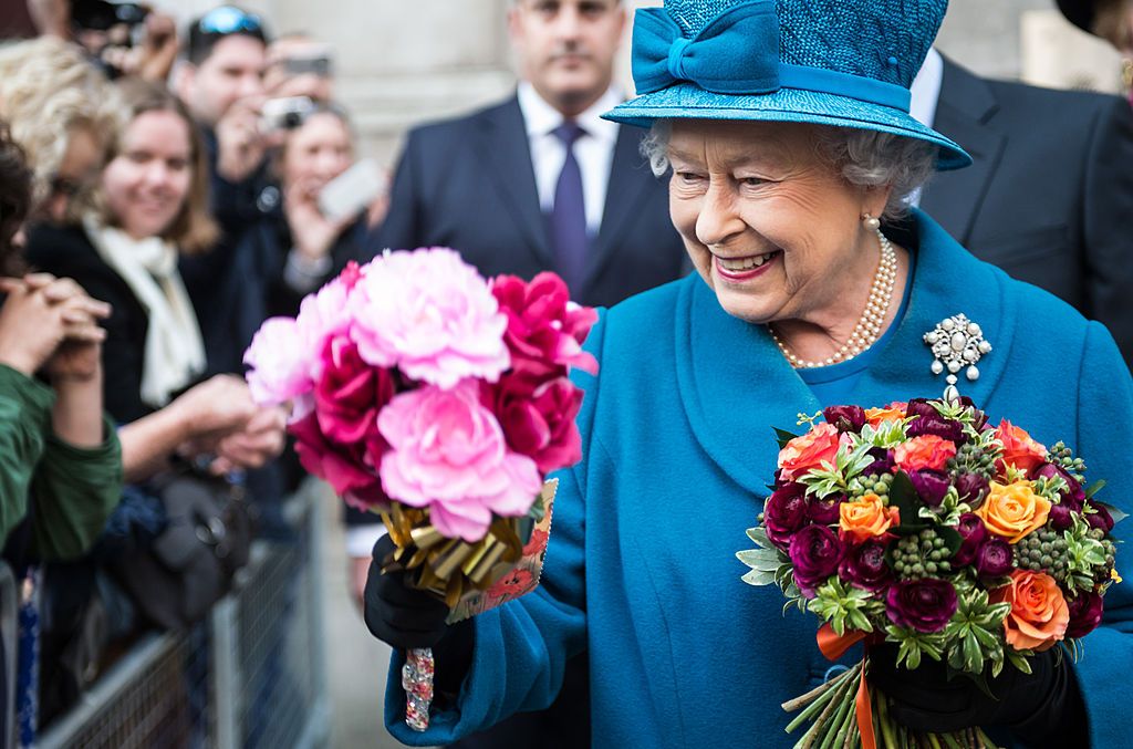 LONDON, ENGLAND - NOVEMBER 14: Queen Elizabeth II meets the crowd after her visit to the Royal Commonwealth Society on November 14, 2012 in London, England. (Photo by Ian Gavan/WPA Pool/Getty Images)